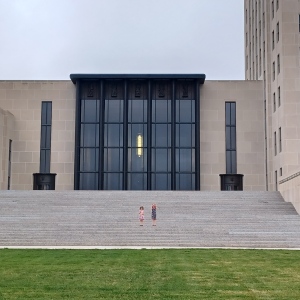 Two children on the steps of the state capitol in Bismarck